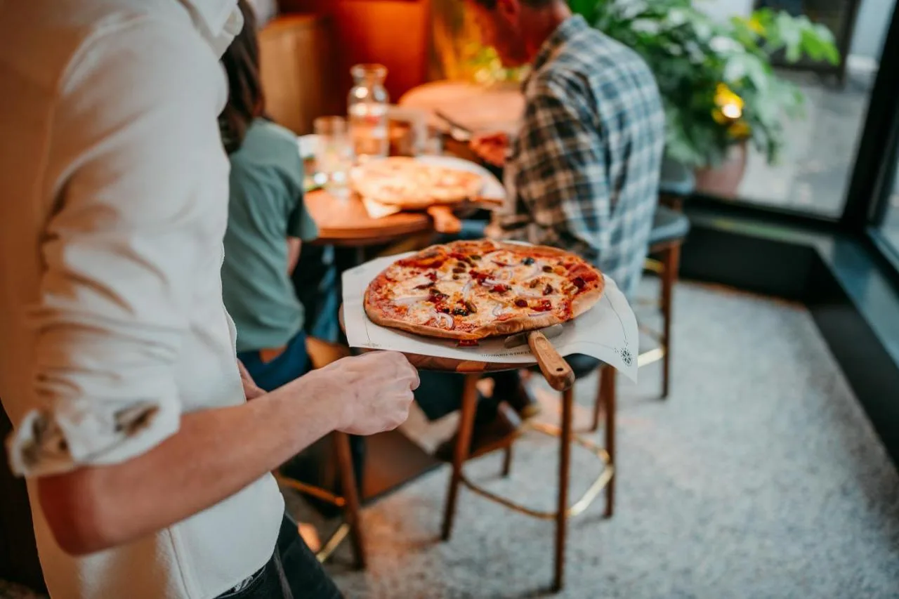 Guest enjoying a meal at The Flint Hotel restaurant in Belfast's Linen Quarter